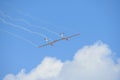 Aerobatic glider on blue sky, withe wings sport team Royalty Free Stock Photo