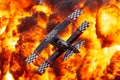 Aerobatic pilot Skip Stewart flying his highly modified Pitts S-2S biplane Prometheus past a pyrotechnics explosion Royalty Free Stock Photo