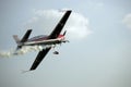 Aerobatic plane trailing smoke Royalty Free Stock Photo