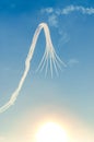 An aerobatic stunt team performs a display over Southport at dusk, looping down and performing a syncronised break with Royalty Free Stock Photo