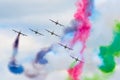 Aerobatic team aircraft fighters trail of smoke in the sky. Royalty Free Stock Photo