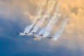 Aerobatic team aircraft fighters trail of smoke in the sky. Royalty Free Stock Photo