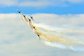 Aerobatic team aircraft fighters trail of smoke in the sky. Royalty Free Stock Photo