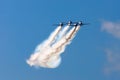 Aerobatic team aircraft fighters trail of smoke in the sky. Royalty Free Stock Photo