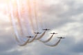 Aerobatic team aircraft fighters trail of smoke in the sky. Royalty Free Stock Photo