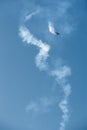 Aerobatics - aerobatic plane, airplane and aircraft is doing manoeuvres on clear blue sky