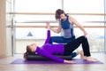 Aerobics Pilates personal trainer helping women Royalty Free Stock Photo