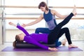 Aerobics Pilates personal trainer helping women Royalty Free Stock Photo