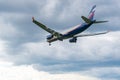 Aeroflot's Airbus A330 VQ-BQZ takes off against a background of thunderstorm clouds. Copy space. Sheremetyevo Royalty Free Stock Photo