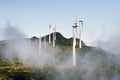 Aerogenerator Windmills In Front Of Ocean Sea