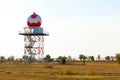 Aeronautical meteorological station tower with spherical radar at airport Royalty Free Stock Photo