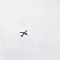 Aeroplane flying in the cloudy sky during the day time near Qutub Minar in Delhi India, Aeroplane flying high in the sky