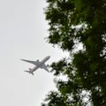 Aeroplane flying in the cloudy sky during the day time near Qutub Minar in Delhi India, Aeroplane flying high in the sky