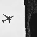 Aeroplane flying in the cloudy sky during the day time near Qutub Minar in Delhi India, Aeroplane flying high in the sky