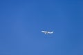 Blank Aeroplane Flying High Above In Blue Sky Royalty Free Stock Photo