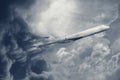 Aeroplane flying through turbulence storm and dark cloud