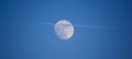 Aeroplane in front of the blue moon