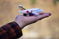 Aeroplane in hand travel world concept Royalty Free Stock Photo