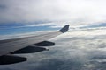 Aeroplane wings over clouds Royalty Free Stock Photo