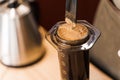 Aeropress coffee close-up alternative making by barista in the cafe. Scandinavian coffee brewing method. Barista mix