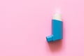 Aerosol for inhalation for the treatment of bronchial asthma on a pink pastel background Royalty Free Stock Photo