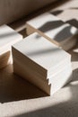 An Aesthetic Arrangement of Blank White Cards with Soft Shadows on a Neutral Surface, Ideal for Creative Projects and Designs Royalty Free Stock Photo