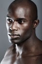 Aesthetic, beauty and face black man on dark background with muscle, motivation for fit and serious person. Health, art