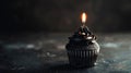 Aesthetic black cupcake with candle, dark background, copy space. Celebration anniversary concept. Generative AI Royalty Free Stock Photo