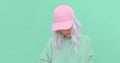 Aesthetic blonde girl in stylish accessories b-boy cap. Fresh vanilla pastel monochrome colours design