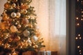 an aesthetic christmas tree decorated with shiny baubles and lights