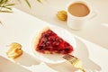 Aesthetic cozy home, breakfast - cherry pie with cup of coffee among winter cherry under hard shadows. Hygge atmosphere