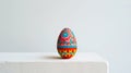 Aesthetic easter egg in traditional red ethnic painting style. White background. Copy space. Generative AI