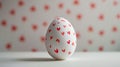 Aesthetic Easter white egg painted with red hearts. White background. Copy space. Generative AI Royalty Free Stock Photo