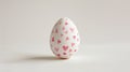 Aesthetic Easter white egg painted with red hearts. White background. Copy space. Generative AI Royalty Free Stock Photo