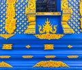 Aesthetic gold ornamentation of Wat Rong Suea Ten Blue Temple at Chiang Rai Thailand