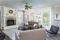 Aesthetic grey living room with large sofas and fireplace - perfect for big family Royalty Free Stock Photo