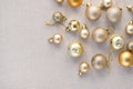Aesthetic luxury Christmas or New Year festive background with copy space. Gold pastel ornaments, decoration balls