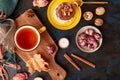 Aesthetic Pavlova cake, Tea Cup. Autumn aesthetics tea time vibes flat lay among dry roses, leaves, blueberry, walnuts Royalty Free Stock Photo