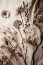 Aesthetic product background with fabric and dried flowers.