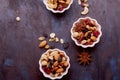 Aesthetic saucers with mixed nuts close up. Walnuts, almonds, hazelnuts, cashew, raisins and cranberries. Healthy food Royalty Free Stock Photo