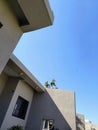 Aesthetically built luxury villa and it's green lawn in the winter afternoon sunlight