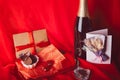 Aesthetics Valentines day postcard. Red seasonal romantic dinner with gift, postcard, champagne and chocolate candies