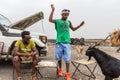 AFAR, ETHIOPIA - MARCH 25, 2019: Tour guides and goats in Dodom village under Erta Ale volcano in Afar depression