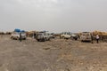 AFAR, ETHIOPIA - MARCH 25, 2019: Tourists in Dodom village under Erta Ale volcano in Afar depression, Ethiop