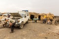 AFAR, ETHIOPIA - MARCH 25, 2019: Tourists in Dodom village under Erta Ale volcano in Afar depression, Ethiop