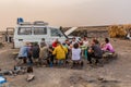 AFAR, ETHIOPIA - MARCH 25, 2019: Tourists eating in Dodom village under Erta Ale volcano in Afar depression, Ethiop