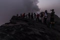 AFAR, ETHIOPIA - MARCH 26, 2019: Tourists at the edge of Erta Ale volcano crater in Afar depression, Ethiop