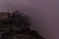 AFAR, ETHIOPIA - MARCH 26, 2019: Tourists at the edge of Erta Ale volcano crater in Afar depression, Ethiop