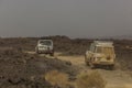 AFAR, ETHIOPIA - MARCH 25, 2019: Vehicles crossing lava fields on their way to Erta Ale volcano in Afar depression