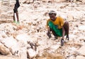 Afar man mining salt from salt flats in Afar region, Danakil Depression, Ethiopia.